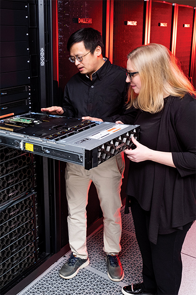 OSC staff examine a node in the new Ascend cluster