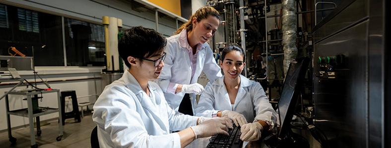 Scientist work at a computer workstation in a lab